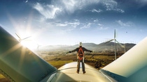 A person and a sustainable wind turbine with lubricant components A person and a sustainable wind turbine with lubricant components