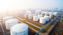 top view of white oil tank in modern refinery plant in blue sky