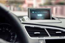 An electric vehicle showing its battery life while charging. An electric vehicle showing its battery life while charging.